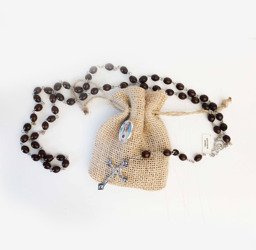 Różaniec drewniany w woreczku z przyminką